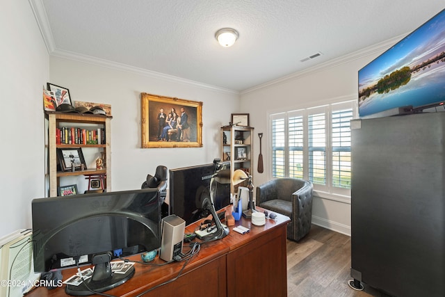 office space featuring a textured ceiling, dark wood-type flooring, and crown molding