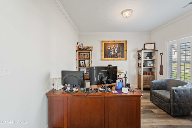 office area featuring a textured ceiling, crown molding, and hardwood / wood-style floors