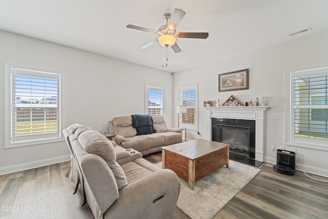 living room featuring hardwood / wood-style floors, ceiling fan, and plenty of natural light