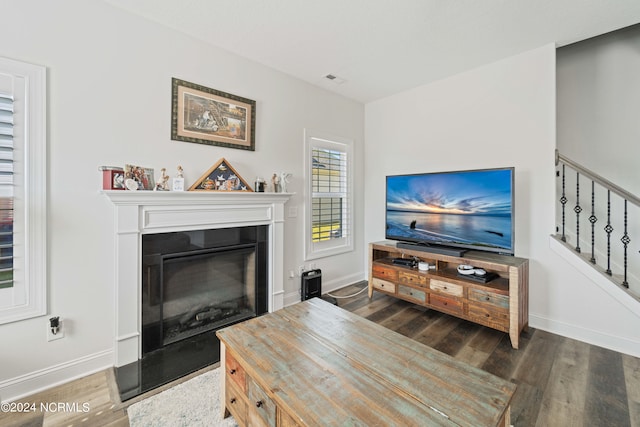 living room with dark hardwood / wood-style floors