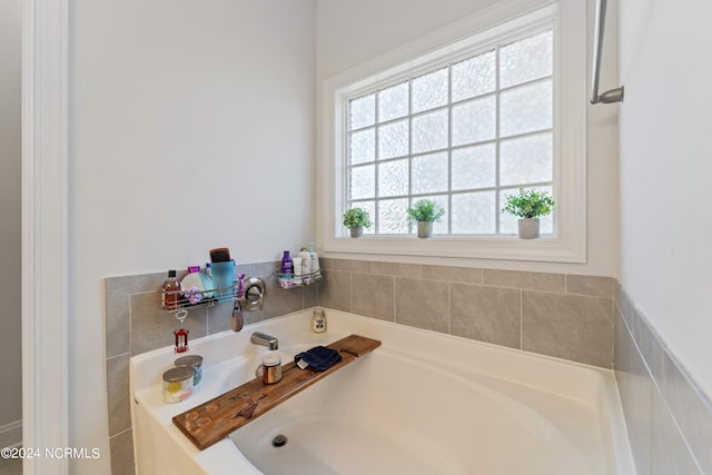 bathroom with a tub to relax in