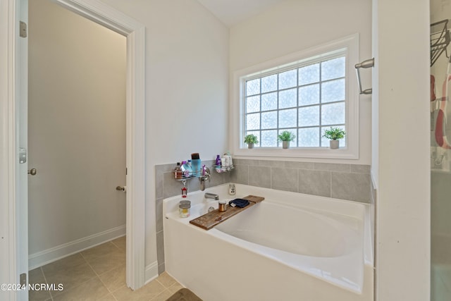 bathroom featuring a bath and tile patterned floors