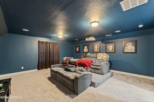 cinema with a textured ceiling and carpet flooring