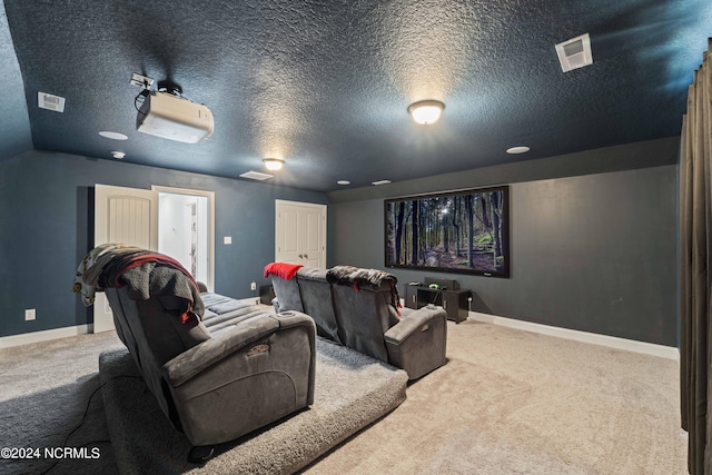 carpeted cinema featuring a textured ceiling