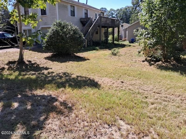 view of yard featuring a wooden deck