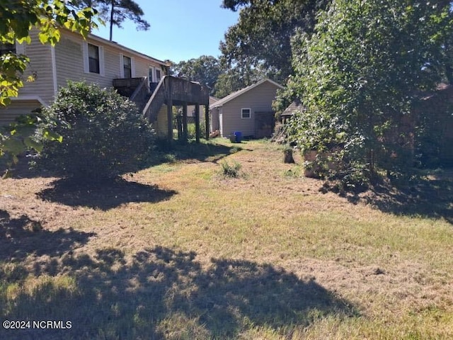 view of yard with a deck