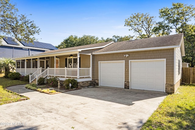 ranch-style house with a porch and a garage