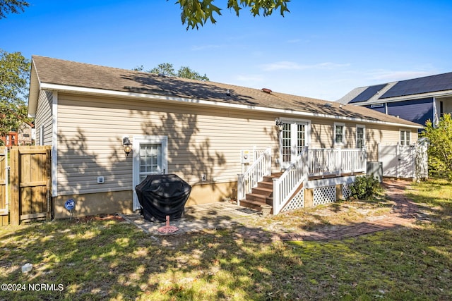 rear view of house with a lawn