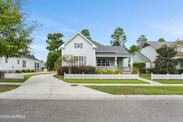 view of front property featuring a front yard and a porch