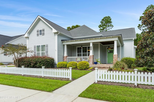 view of front of property with a front lawn and a porch