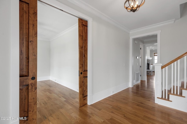 hall featuring wood-type flooring and ornamental molding