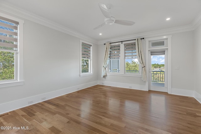 unfurnished room featuring ornamental molding, hardwood / wood-style floors, and ceiling fan