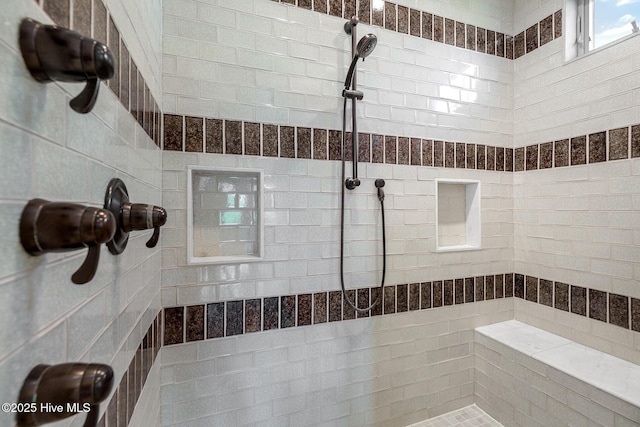 bathroom featuring tiled shower