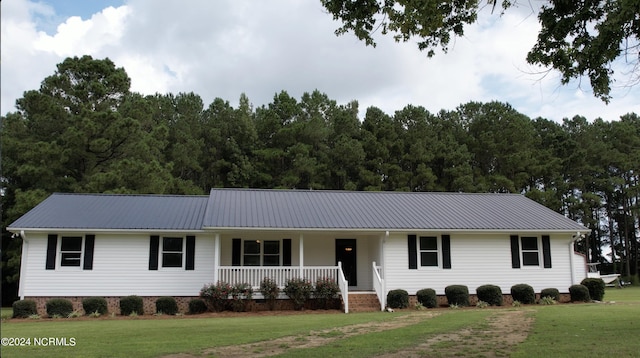 ranch-style house featuring a front yard and a porch