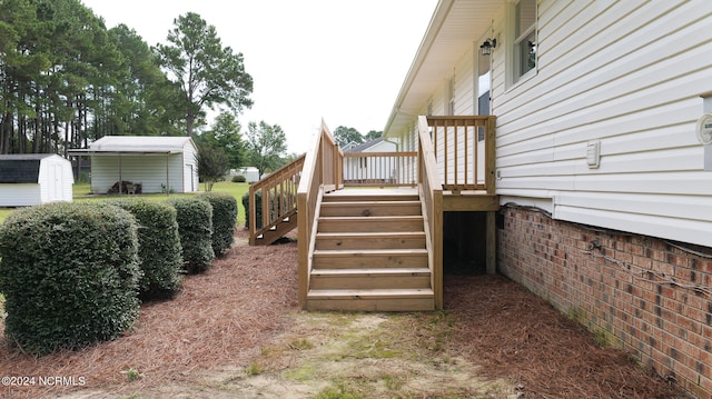 view of yard featuring a shed and a deck