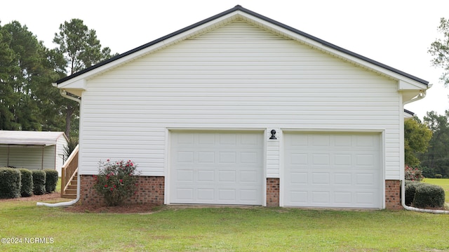 garage with a lawn