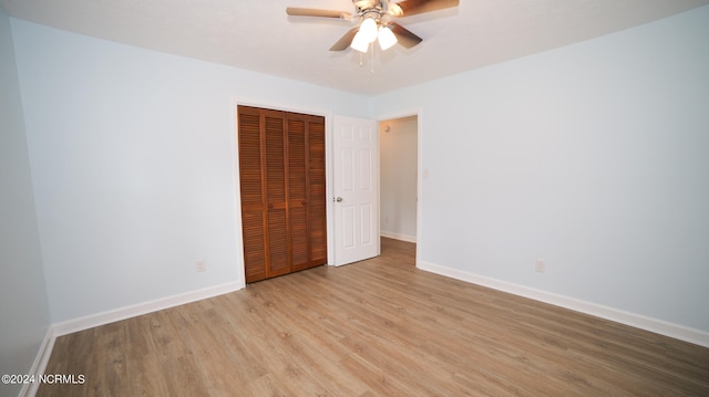 unfurnished room with light wood-type flooring and ceiling fan