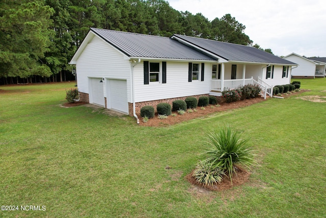 ranch-style house featuring a front lawn, a porch, and a garage