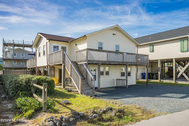 rear view of property with a wooden deck