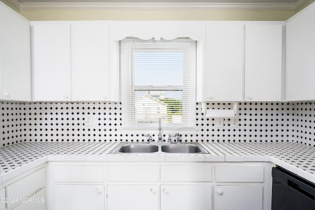 kitchen featuring white cabinets, dishwasher, and sink