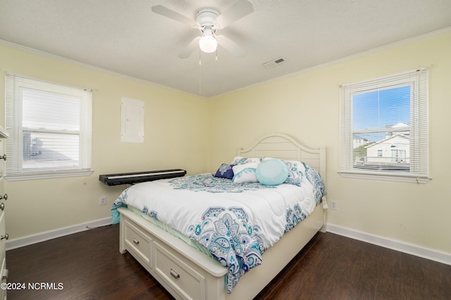 bedroom featuring ornamental molding, multiple windows, ceiling fan, and dark hardwood / wood-style flooring