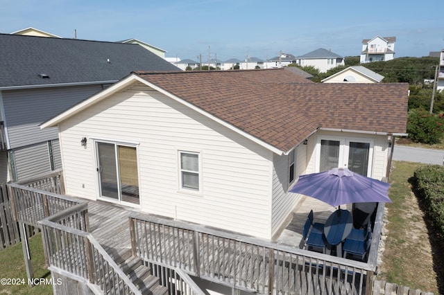 back of house featuring a wooden deck