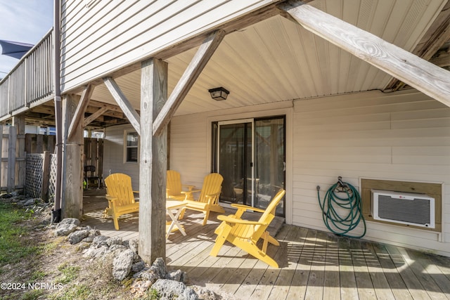 deck featuring an AC wall unit