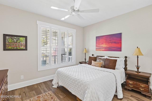 bedroom featuring ceiling fan and dark hardwood / wood-style flooring