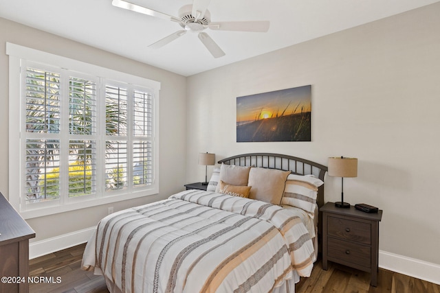 bedroom featuring ceiling fan and dark hardwood / wood-style floors