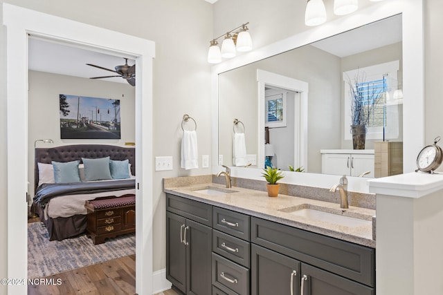 bathroom featuring ceiling fan, vanity, and hardwood / wood-style floors