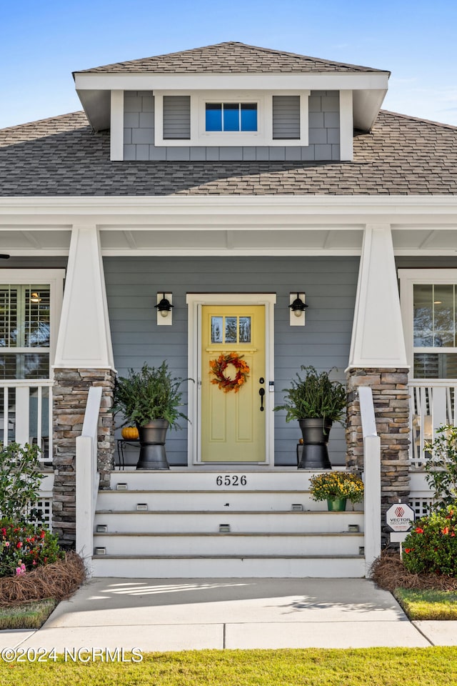 property entrance with a porch