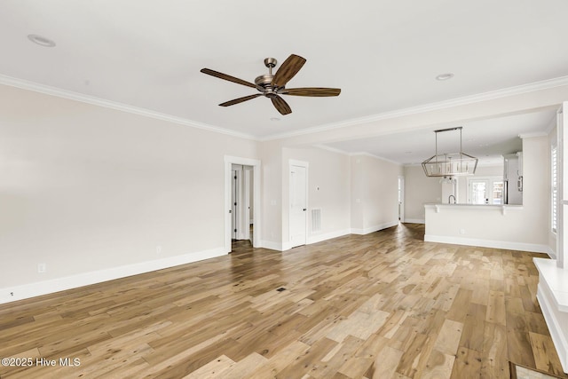 unfurnished living room with ornamental molding, ceiling fan, and light hardwood / wood-style flooring