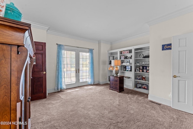 interior space with carpet flooring, visible vents, access to exterior, ornamental molding, and french doors