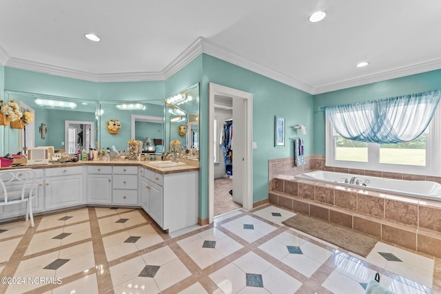 bathroom with ornamental molding, recessed lighting, a sink, and baseboards