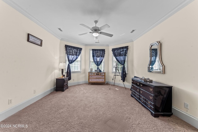 bedroom with carpet, visible vents, ornamental molding, a ceiling fan, and baseboards