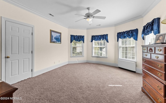 bedroom featuring a ceiling fan, visible vents, baseboards, ornamental molding, and carpet