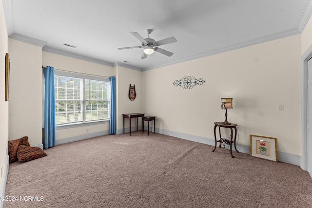 carpeted empty room featuring baseboards, visible vents, a ceiling fan, and ornamental molding