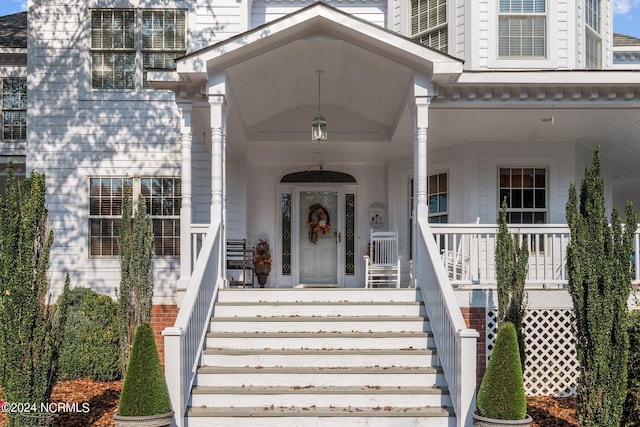 property entrance with covered porch