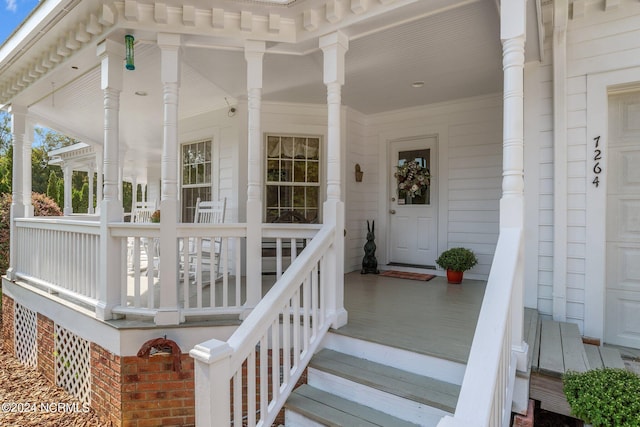 property entrance with covered porch