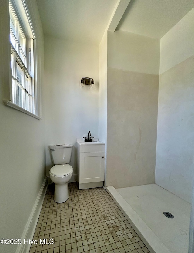 bathroom with sink, a shower, tile patterned floors, and toilet