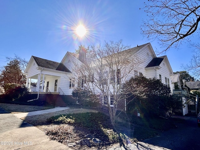 view of property exterior with a porch