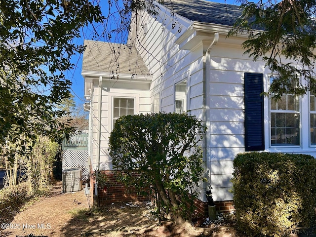 view of side of property featuring cooling unit