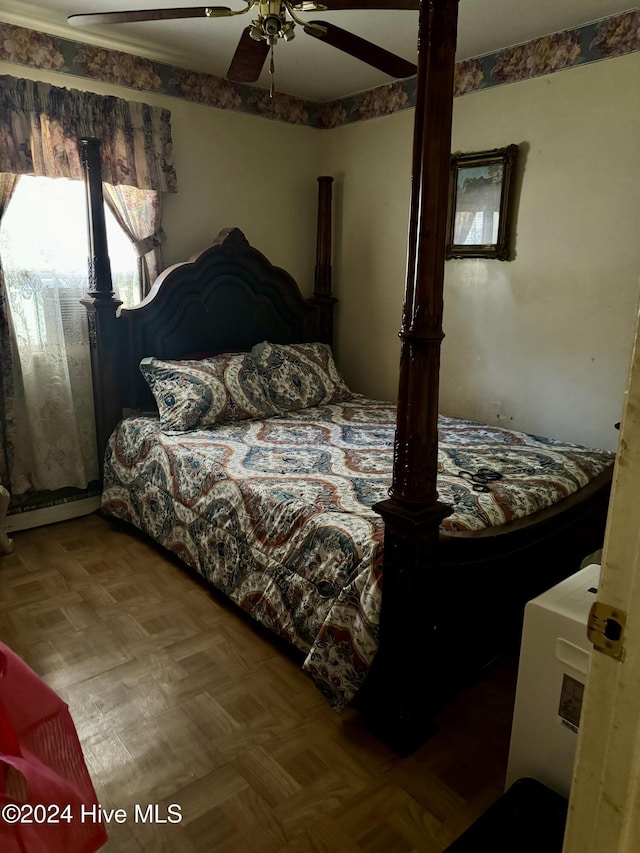 bedroom with parquet flooring and ceiling fan