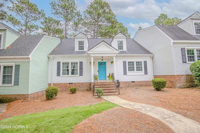 cape cod-style house with roof with shingles and crawl space