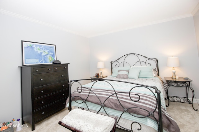 bedroom featuring ornamental molding and light colored carpet