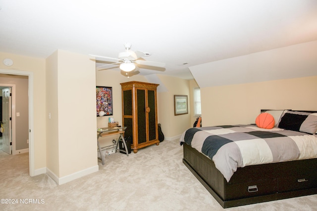 carpeted bedroom with baseboards, ceiling fan, and lofted ceiling