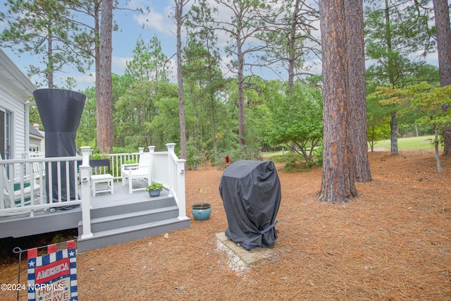 view of yard with a wooden deck