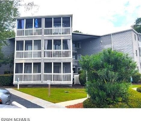 10166 Beach Dr SW Unit 5306, Calabash, NC 28467 - view of front facade featuring a balcony