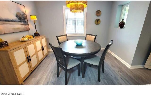 10166 Beach Dr SW Unit 5306, Calabash, NC 28467 - dining area with light wood-style floors and plenty of natural light