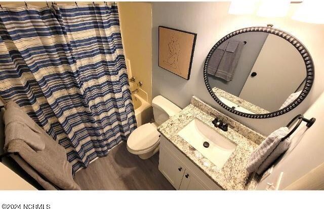 10166 Beach Dr SW Unit 5306, Calabash, NC 28467 - full bathroom featuring wood finished floors, vanity, and shower / tub combo with curtain